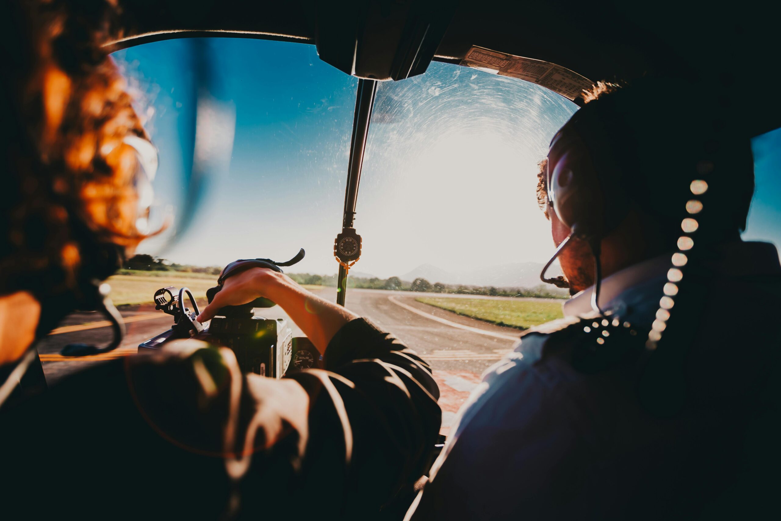 Aerial view from a helicopter cockpit with pilots over Rio de Janeiro.